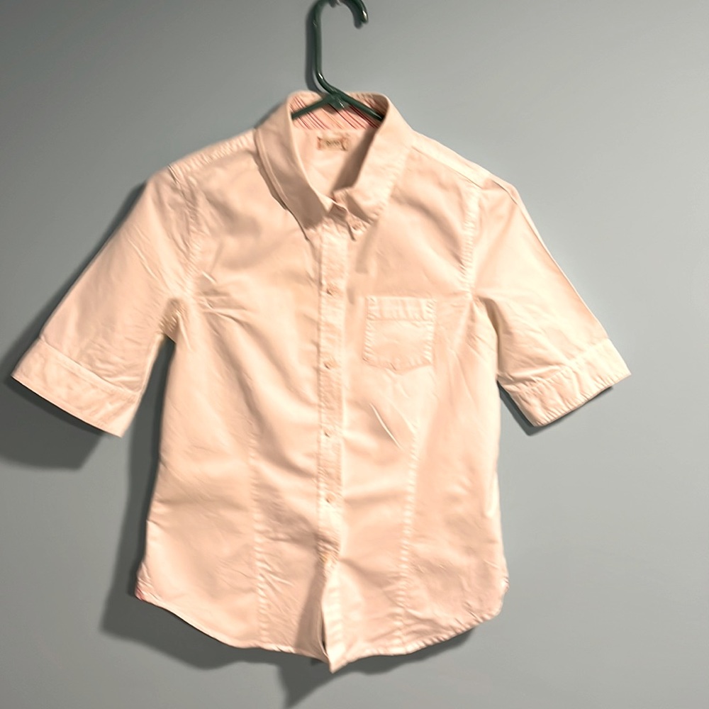 Crisp white 3/4 sleeve button down shirt.